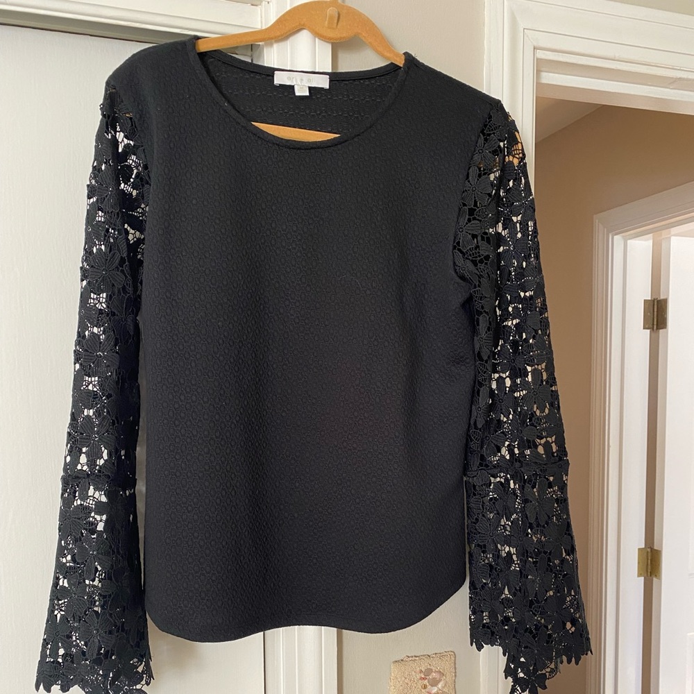 Great dress up or down top. Hirgeous lace sleeves. Jeans or pants works eell